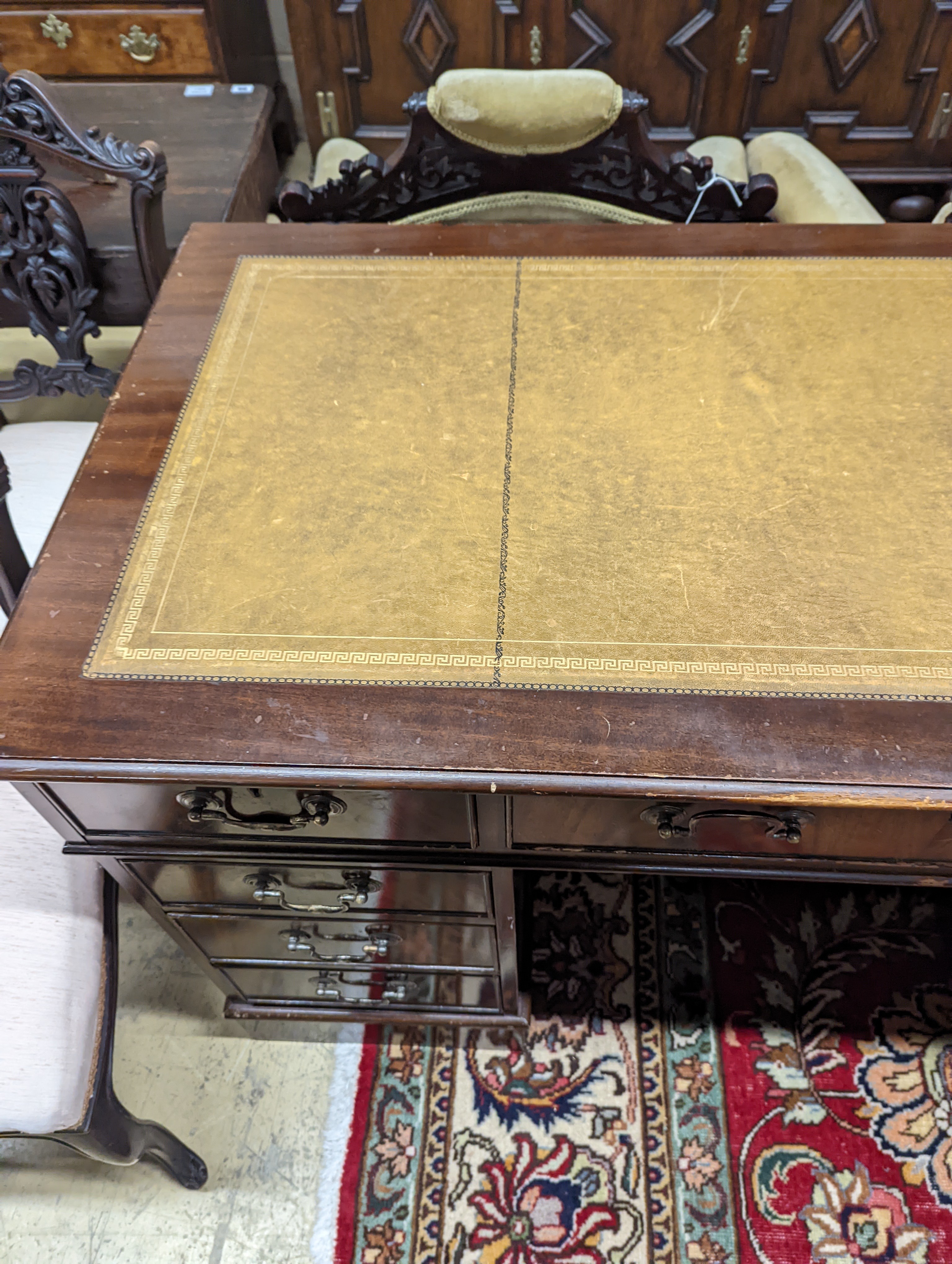 A reproduction mahogany pedestal desk, length 138cm, depth 69cm, height 79cm